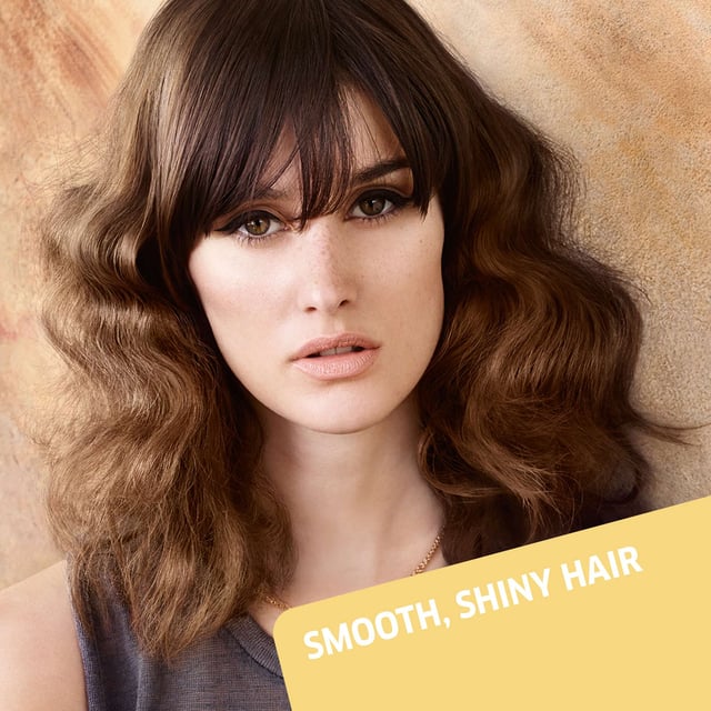 Achieve stunning shine and smoothness with Wella EIMI Just Brilliant Pomade. This professional-grade hair pomade is specially designed to enhance your hairstyle while providing natural anti-frizz definition. Its unique formula protects against humidity, ensuring your hair remains sleek and polished all day. To use, simply apply a small amount to your palms and gently work through dry hair to perfect your look. Ideal for all hair types, this 75ml pomade is a must-have for anyone seeking a flawless finish.
