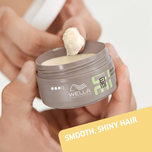 Achieve stunning shine and smoothness with Wella EIMI Just Brilliant Pomade. This professional-grade hair pomade is specially designed to enhance your hairstyle while providing natural anti-frizz definition. Its unique formula protects against humidity, ensuring your hair remains sleek and polished all day. To use, simply apply a small amount to your palms and gently work through dry hair to perfect your look. Ideal for all hair types, this 75ml pomade is a must-have for anyone seeking a flawless finish.
