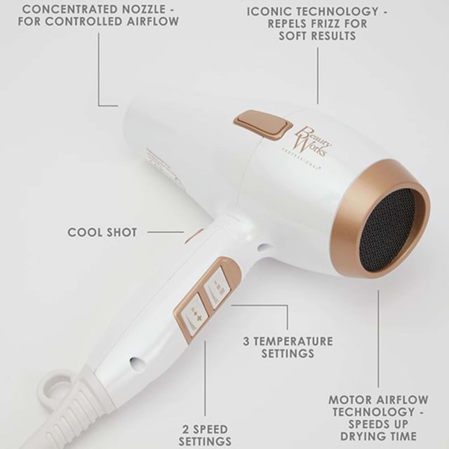 Experience salon-quality results at home with the Beauty Works Hair Dryer Kit. This powerful dryer features a 1935-2300W brushless DC motor that reduces drying time while delivering smooth, shiny hair. The ionic conditioning technology eliminates frizz, leaving your hair healthier and manageable. Customize your drying experience with three heat settings and two speed options, plus a cool shot for lasting styles. The kit includes two concentrator nozzles for precision styling and a ceramic brush for easy sectioning. Complete with a stylish dust bag for storage.