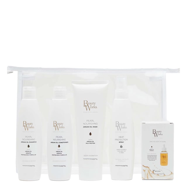 Beauty Works Argan Moisture Repair Gift Set for Luxurious Hair Care Revitalize your hair with the Beauty Works Argan Moisture Repair Gift Set. This essential hair care set includes a 250ml Pearl Nourishing Shampoo, a 250ml Argan Oil Conditioner, a 250ml Nourishing Argan Oil Mask, a 90ml Argan Oil Serum, and a 250ml Heat Protection Spray. Infused with organic Argan Oil and Milk Protein, these products nourish and protect your hair extensions, keeping them soft, shiny, and healthy. Ideal for maintaining beautiful hair.