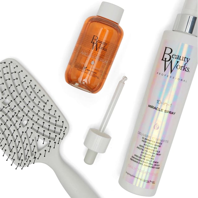 Discover the Beauty Works Styling Heroes Gift Set, your ultimate solution for radiant, healthy hair. This luxurious set includes three essential products: the Beauty Works Detangling Brush, 10-in-1 Miracle Spray (250ml), and Argan Serum (90ml). The detangling brush glides through hair, while the Miracle Spray nourishes and protects against heat damage. The Argan Serum locks in hydration and enhances shine. Elevate your hair care routine with this must-have set!