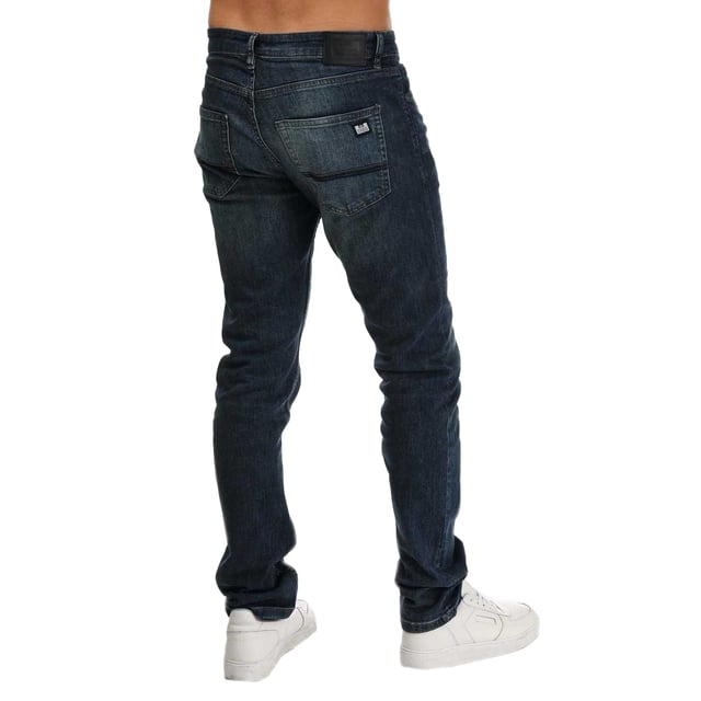 99% bomull, 1% elastan. Tyg: Denim, stretch. Design: Logotyp, slät yta. Fickor: 2 sidofickor, 2 bakfickor, 1 myntficka. Fästning: Knapp, blixtlås. Bältesöglor, kontrastsömmar. Passform: Konisk.