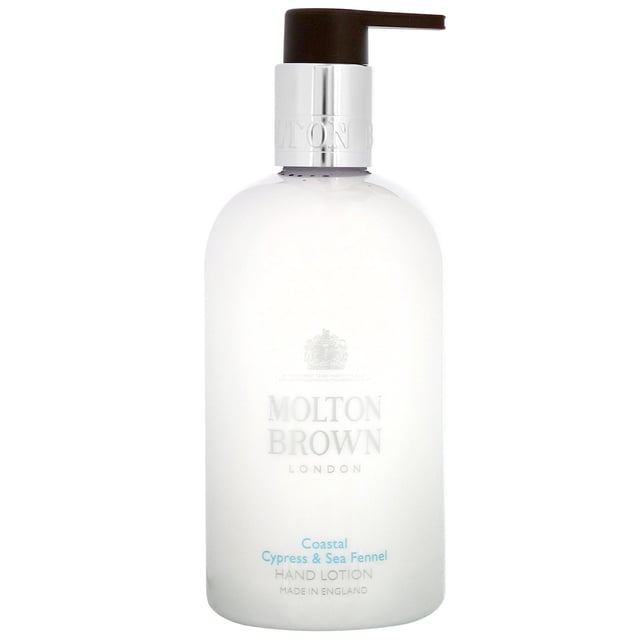 Molton Brown Coastal Cypress & Sea Fennel Hydrating Hand Lotion 300ml Experience the invigorating essence of the ocean with Molton Brown's Coastal Cypress & Sea Fennel Hand Lotion. This luxurious lotion combines marine-inspired notes of salt, blue cypress, and Australian sea fennel to provide a refreshing and aromatic experience. Perfect for unisex use, this 300ml hand lotion hydrates and revitalizes your hands, leaving them feeling soft and nourished. Embrace the spirit of adventure while knowing you are using a cruelty-free product, approved by Leaping Bunny. Treat yourself to this essential bath and body care.