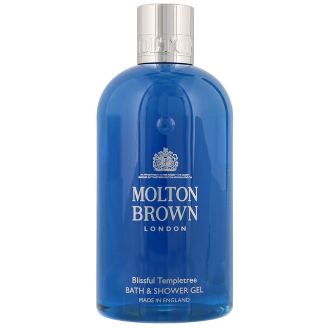 Experience luxury with Molton Brown's Blissful Templetree Bath & Shower Gel. This exquisite cleansing gel offers a refreshing blend of calming florals, starting with a crisp opening of orange, fruity rose, and gardenia. The heart reveals a sweet indulgence of jasmine, lilac, and honey, while the base notes of amber, patchouli, sandalwood, and vanilla create a captivating finish. Perfect for women seeking a rejuvenating bath experience, this cruelty-free gel is a must-have for your bath and body collection.