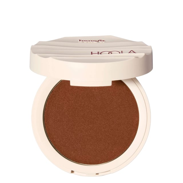 Experience the ultimate sun-kissed glow with Benefit Hoola Wave Deep Cream Bronzer. This luxurious, buttery-soft balm glides on effortlessly, transforming into a natural finish that beautifully enhances your complexion. Perfect for achieving a stunning bronzed look without the need for a beach getaway! The bronzer features buildable coverage for a customizable glow. Infused with nourishing jojoba seed oil, shea butter, and avocado oil, your skin feels hydrated and healthy. Waterproof, smudge-proof, and long-lasting for up to 12 hours, it's the perfect addition to your makeup routine.