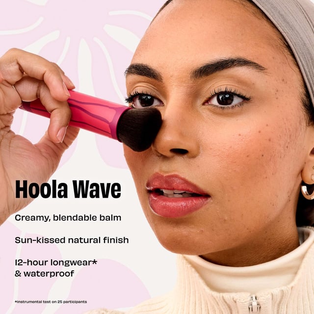 Experience the ultimate sun-kissed glow with Benefit Hoola Wave Deep Cream Bronzer. This luxurious, buttery-soft balm glides on effortlessly, transforming into a natural finish that beautifully enhances your complexion. Perfect for achieving a stunning bronzed look without the need for a beach getaway! The bronzer features buildable coverage for a customizable glow. Infused with nourishing jojoba seed oil, shea butter, and avocado oil, your skin feels hydrated and healthy. Waterproof, smudge-proof, and long-lasting for up to 12 hours, it's the perfect addition to your makeup routine.