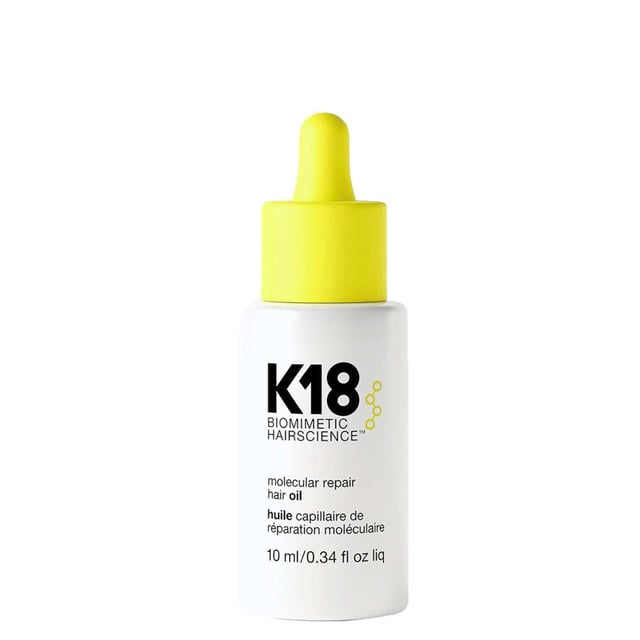 Transform your hair with K18 Biomimetic Hairscience Molecular Repair Hair Oil. This 10ml lightweight formula softens, smooths, and strengthens your hair in a single step. Infused with K18PEPTIDE, nourishing oils, and squalane, it effectively targets damage that causes frizz while enhancing shine and offering heat protection. Ideal for use on damp or dry hair, it effortlessly tames flyaways and revitalizes vibrancy without weighing your hair down. Perfect for all hair types, this cruelty-free and vegan-friendly oil is a must-have for your hair care routine.