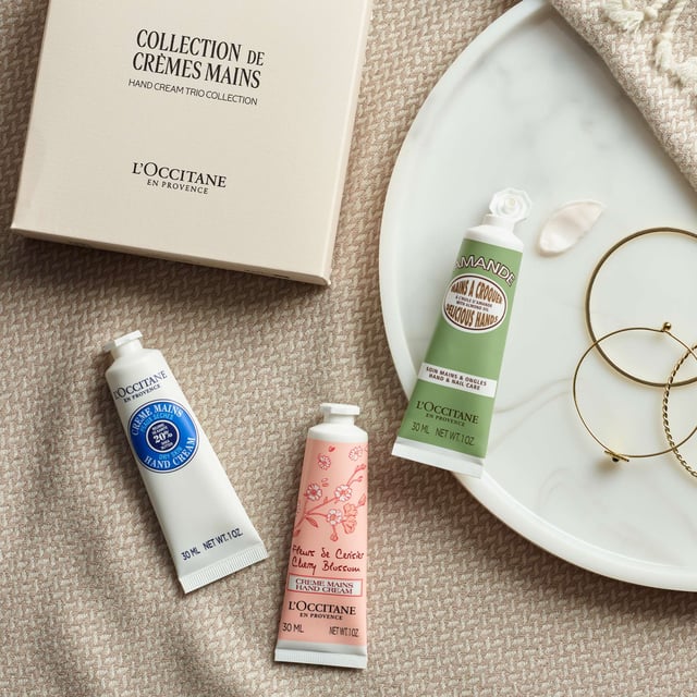 L'OCCITANE Essential Hand Cream Trio Gift Set for Soft Hands Experience the ultimate hand care with the L'OCCITANE Essential Hand Cream Trio Gift Set. This luxurious collection features three of L'OCCITANE's most popular hand creams: Shea Butter for deep nourishment, Almond for silky smoothness, and Cherry Blossom for a delightful floral scent. Each 30ml cream is perfect for keeping your hands soft and hydrated throughout the day. Ideal for gifting or treating yourself, this set is a must-have for anyone who values quality skincare. Enjoy the nourishing benefits of nature with L'OCCITANE.