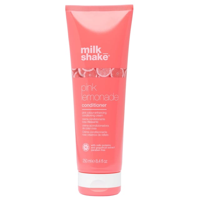 Experience the refreshing benefits of the milk_shake Pink Lemonade Conditioner. Formulated with milk proteins and grapefruit extract, this unique conditioner nourishes your hair while imparting a subtle pink hue. Designed to enhance your hair's beauty and vitality, it deeply conditions without compromising health. Simply apply to washed hair, focusing on the strands, and leave on for 5-20 minutes before rinsing thoroughly. Perfect for women seeking vibrant, healthy hair, this conditioner is a must-have in your hair care routine.
