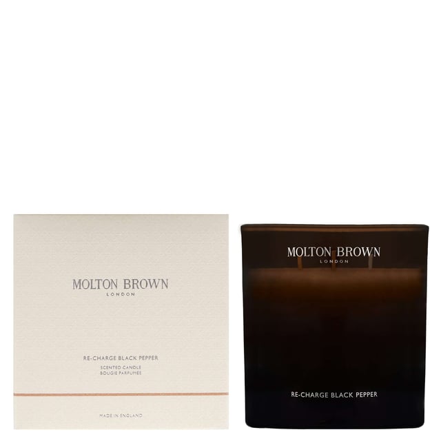 Indulge your senses with the Molton Brown Re-Charge Black Pepper Candle, a captivating home fragrance launched in 2015. This exquisite 600g candle features an aromatic blend that opens with invigorating top notes of black pepper, lemon, and ginger. The heart reveals a sophisticated mix of coriander, basil, and violet leaf, while the base is enriched with earthy vetiver, oakmoss, and luxurious ambergris. Perfect for creating a warm and inviting atmosphere, this cruelty-free candle is a must-have for any home fragrance enthusiast.