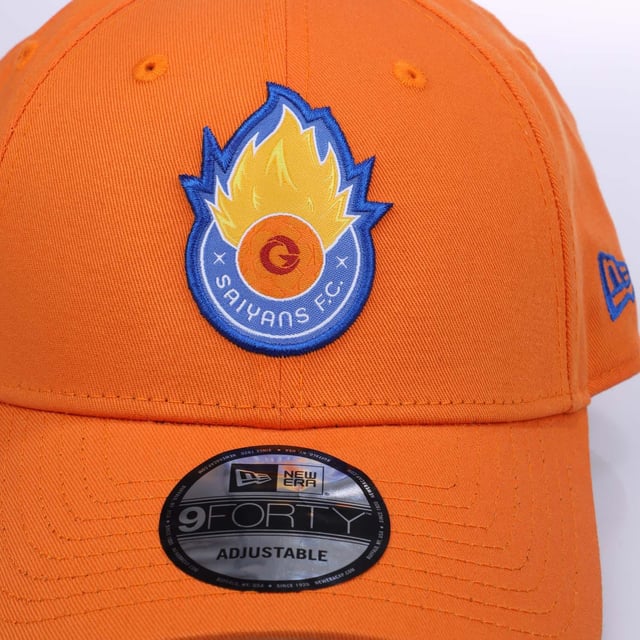 New Era Core 9FORTY Saiyans Cap in orange.- Adjustable metal closure.- Curved visor.- New Era Flag on left side.- 100% Cotton.- Ref: 60603655