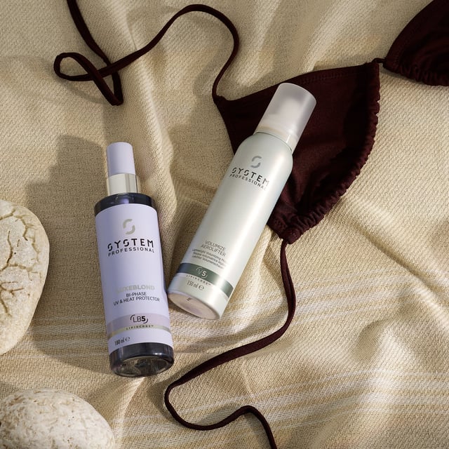 Discover the ultimate care for your blonde hair with System Professional LuxeBlond Bi-Phase UV & Heat Protector. This advanced leave-in conditioning spray not only protects against UV and heat damage up to 220°C but also reduces breakage by up to 99%. Enriched with LipidCode Complex, it enhances the resilience of your hair fibers, making them more manageable and easy to style. Ideal for women seeking to maintain vibrant, healthy blonde locks, this 180ml spray is a must-have in your hair care routine.