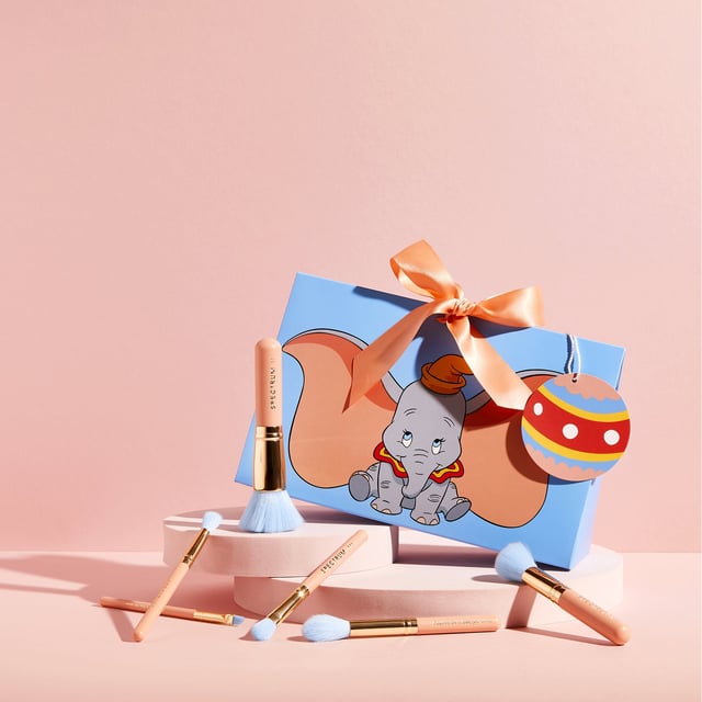 Spectrum Disney Dumbo 6 Piece Mini Makeup Brush Set for Women - 110 grams Elevate your makeup routine with the Spectrum Disney Dumbo 6 Piece Mini Makeup Brush Set. This enchanting set features six expertly crafted mini brushes designed for foundation, cheeks, eyes, and brows, making it ideal for any makeup enthusiast. Each brush is beautifully themed after Dumbo, adding a touch of Disney magic to your beauty collection. Packaged in eco-friendly, gift-ready packaging, it's the perfect gift for yourself or a loved one. Experience seamless application and playful charm with every brush stroke.