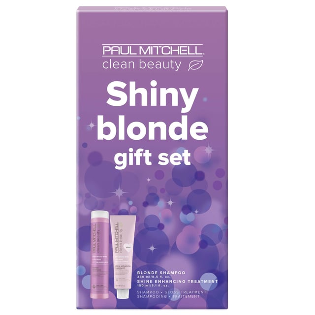 Discover the ultimate hair care experience with the Paul Mitchell Shiny Blonde Gift Set. This luxurious set features Clean Beauty Blonde Shampoo (250ml) and Shine Enhancing Treatment Gloss (150ml), designed for blonde, highlighted, silver, or grey hair. The purple toning shampoo cleanses while eliminating brassy tones, infused with pomegranate extract to prevent color fade. The treatment gloss nourishes each strand with borage oil, delivering a smooth finish and natural shine. Perfect for vegans, this set revitalizes your hair, making it vibrant and beautiful.