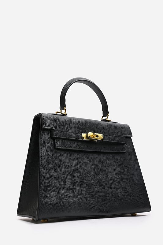 Elevate your everyday ensemble with this Lluvia Top Handle Satchel Mini Tote Bag, a timeless choice for modern elegance. Featuring a structured silhouette and refined grain-textured finish, this handbag blends style and practicality effortlessly. The polished gold-tone turn-lock closure adds a touch of sophistication. Ideal for work or weekend outings, it’s compact yet roomy enough for your essentials. Key Features: • Material: Textured faux leather with contrast stitching • Dimensions: 25cm (L) x 20cm (H) x 11cm (W) • Fastening: Gold-tone turn-lock flap closure • Detail: Minimalist top handle design with structured base and sleek finish 
