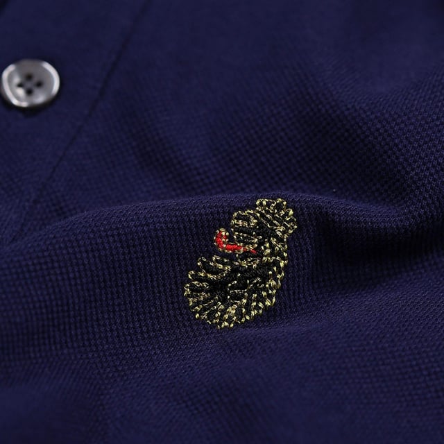 100% Cotton. Design: Embroidered Logo. Neckline: Ribbed, Taped, Trimmed, Turn Down Collar. Cuff: Ribbed. Sleeve-Type: Short-Sleeved. 3 Button Placket, Inner Placket. 220gsm. XS: 36 in. S: 38 in.