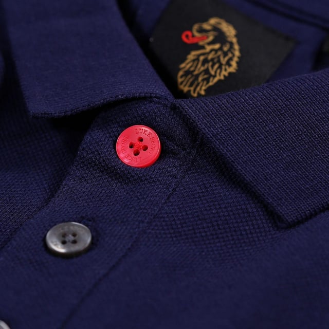 100% Cotton. Design: Embroidered Logo. Neckline: Ribbed, Taped, Trimmed, Turn Down Collar. Cuff: Ribbed. Sleeve-Type: Short-Sleeved. 3 Button Placket, Inner Placket. 220gsm. XS: 36 in. S: 38 in.