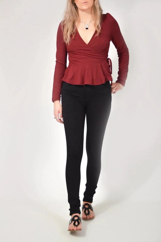 Wear day-to-night, this wrap top is the ultimate day to evening piece that never goes out of style. Whether you dress down with jeans for a low-key vibe or drop jaws with a pair of smart trousers, this is the versatile wardrobe staple that you won't be able to live without. With an elegant gathered puff shoulder, fine rib detailing, this item will be a regular go to.