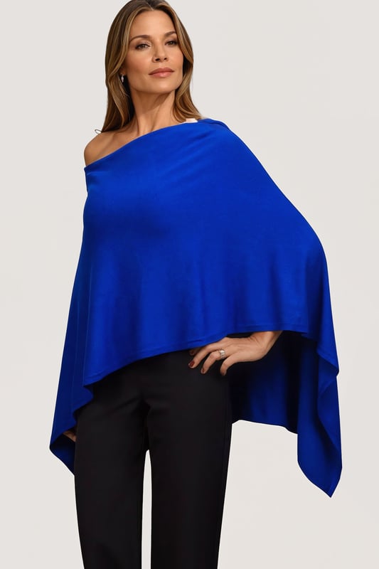 This gorgeous soft knit poncho from Betty Barclay is made from a fine viscose blend knit. In a royal blue hue, this poncho can be worn as a slash neck or cowl neck (simply turn around) and is the perfect cover for summer evenings, or winter parties.
Smooth Fine Knit
Wide Slash Neck
Front 18" Back 29" Shoulder to Hem
These are end of line ex Betty Barclay.