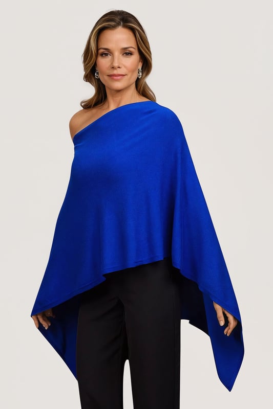 This gorgeous soft knit poncho from Betty Barclay is made from a fine viscose blend knit. In a royal blue hue, this poncho can be worn as a slash neck or cowl neck (simply turn around) and is the perfect cover for summer evenings, or winter parties.
Smooth Fine Knit
Wide Slash Neck
Front 18" Back 29" Shoulder to Hem
These are end of line ex Betty Barclay.