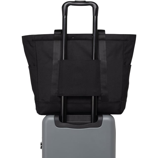 A timeless tote. Made with recycled fabrics and our signature diamond detail, this large tote is packed with organizing features that carry you through work, travel and everyday journeys.