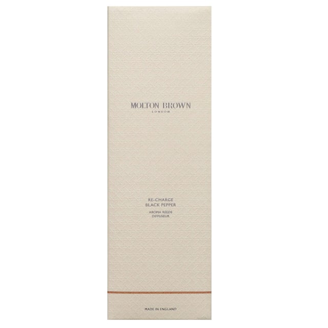 Molton Brown Re-Charge Black Pepper Aroma Reeds - Spicy Room Fragrance 150ml Elevate your space with the Molton Brown Re-Charge Black Pepper Aroma Reeds, a captivating spicy fragrance launched in 2015. This unique scent features invigorating top notes of black pepper, lemon, and ginger, complemented by aromatic middle notes of coriander, basil, and violet leaf. The rich base notes of vetiver, oakmoss, and ambergris create a warm, inviting atmosphere. Simply let the reeds absorb the scented oil and place them in a central location to enjoy the delightful aroma throughout your home. Molton Brown is a cruelty-free brand, proudly Leaping Bunny approved.