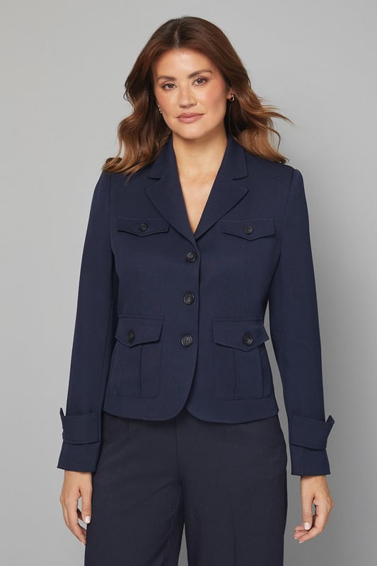 Structured utility jacket featuring four practical front pockets with button closures
        Classic collared neckline with smart lapels for a sophisticated silhouette
        Button-through front fastening with contrasting buttons for added detail
        Tailored regular fit with slight stretch for comfortable all-day wear
        Neat cuff detailing with button accents for a polished finish
    
    This versatile Four Pocket Utility Jacket from Wallis combines practicality with sophisticated style. The structured silhouette offers a flattering shape whilst maintaining comfort through its regular fit and slight stretch. Style with wide-leg denim trousers and a simple white tee for an effortlessly chic daytime look, perfect for weekend brunches or casual shopping trips. Add a leather belt to define the waist and complement with ankle boots for a coordinated ensemble. The neutral tone makes this jacket an excellent layering piece for transitional weather, working beautifully over lightweight jumpers or simple tops. For family gatherings or lunch dates, pair with tailored trousers and ballet flats for a smart-casual outfit that conveys understated elegance. This jacket will quickly become a cornerstone of your casual wardrobe, offering both functionality and style.