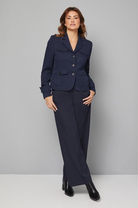 Structured utility jacket featuring four practical front pockets with button closures
        Classic collared neckline with smart lapels for a sophisticated silhouette
        Button-through front fastening with contrasting buttons for added detail
        Tailored regular fit with slight stretch for comfortable all-day wear
        Neat cuff detailing with button accents for a polished finish
    
    This versatile Four Pocket Utility Jacket from Wallis combines practicality with sophisticated style. The structured silhouette offers a flattering shape whilst maintaining comfort through its regular fit and slight stretch. Style with wide-leg denim trousers and a simple white tee for an effortlessly chic daytime look, perfect for weekend brunches or casual shopping trips. Add a leather belt to define the waist and complement with ankle boots for a coordinated ensemble. The neutral tone makes this jacket an excellent layering piece for transitional weather, working beautifully over lightweight jumpers or simple tops. For family gatherings or lunch dates, pair with tailored trousers and ballet flats for a smart-casual outfit that conveys understated elegance. This jacket will quickly become a cornerstone of your casual wardrobe, offering both functionality and style.