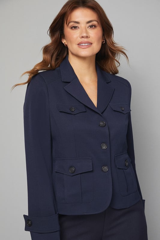 Structured utility jacket featuring four practical front pockets with button closures
        Classic collared neckline with smart lapels for a sophisticated silhouette
        Button-through front fastening with contrasting buttons for added detail
        Tailored regular fit with slight stretch for comfortable all-day wear
        Neat cuff detailing with button accents for a polished finish
    
    This versatile Four Pocket Utility Jacket from Wallis combines practicality with sophisticated style. The structured silhouette offers a flattering shape whilst maintaining comfort through its regular fit and slight stretch. Style with wide-leg denim trousers and a simple white tee for an effortlessly chic daytime look, perfect for weekend brunches or casual shopping trips. Add a leather belt to define the waist and complement with ankle boots for a coordinated ensemble. The neutral tone makes this jacket an excellent layering piece for transitional weather, working beautifully over lightweight jumpers or simple tops. For family gatherings or lunch dates, pair with tailored trousers and ballet flats for a smart-casual outfit that conveys understated elegance. This jacket will quickly become a cornerstone of your casual wardrobe, offering both functionality and style.