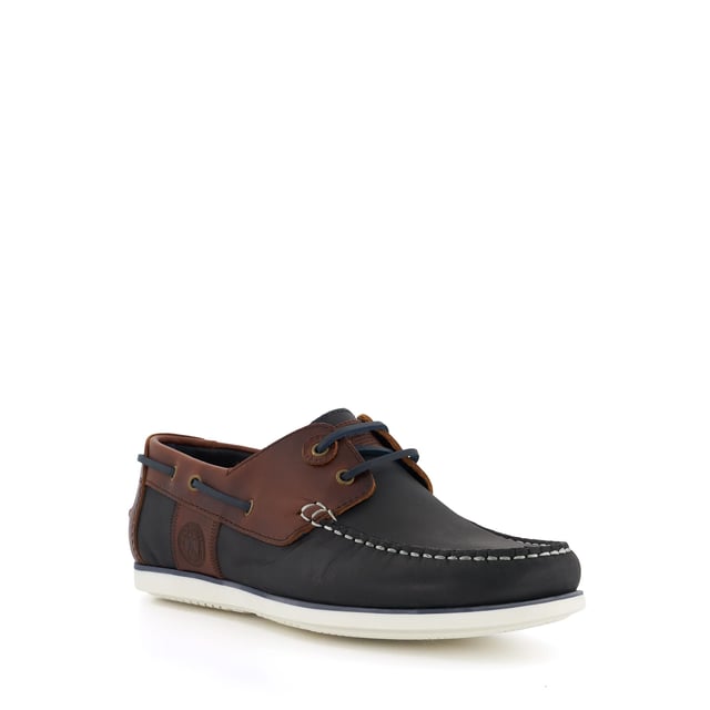 The Men's Barbour Wake is a classic style boat shoe, with contrast thread detailing, two eyelets and quintessential lace detailing. Crafted from the finest material and promising endless comfort, this timeless silhouette is finished with subtle Barbour branding that enhances the style. Set on a contrasting sole, they pair perfectly with rolled-up chinos and chambray shirts.