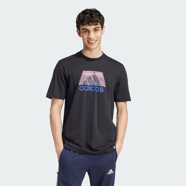 This adidas tee lets you rep your play everywhere you go. It features a rubber screenprint graphic and a stitched-down woven sign-off label. The pure cotton build is perfect paired with joggers for a casual coffee meetup or distressed jeans for a night out.  - Regular fit - Ribbed crewneck - 100% cotton  Shipped by adidas