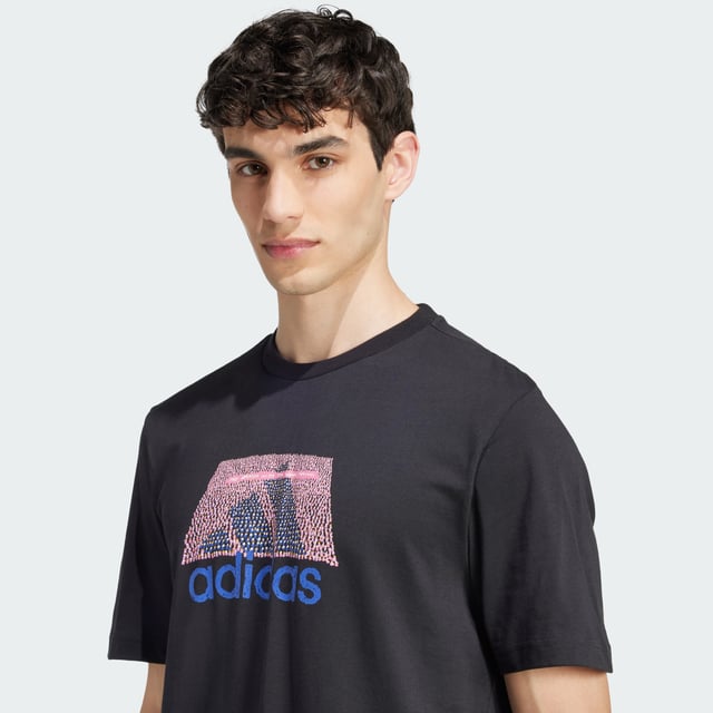 This adidas tee lets you rep your play everywhere you go. It features a rubber screenprint graphic and a stitched-down woven sign-off label. The pure cotton build is perfect paired with joggers for a casual coffee meetup or distressed jeans for a night out.  - Regular fit - Ribbed crewneck - 100% cotton  Shipped by adidas