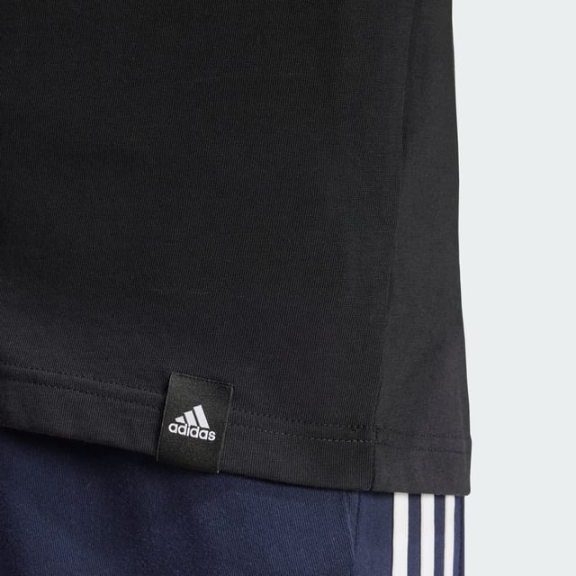 This adidas tee lets you rep your play everywhere you go. It features a rubber screenprint graphic and a stitched-down woven sign-off label. The pure cotton build is perfect paired with joggers for a casual coffee meetup or distressed jeans for a night out.  - Regular fit - Ribbed crewneck - 100% cotton  Shipped by adidas