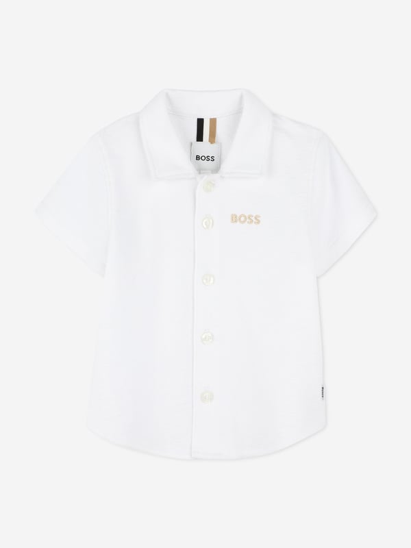 Introduce a touch of elegance to your little gentlemans wardrobe with the BOSS Baby Boys Short Sleeve Shirt in White, crafted for SS2025. Exquisitely tailored by BOSS, this shirt is a luxurious staple for any young wardrobe. Essentials include Elegant Design Classic white hue, ensuring timeless style. Luxurious Comfort Fabricated with premium, soft materials, perfect for delicate skin. Versatile Style Ideal for special occasions or casual playdates.Elevate your little ones ensemble with this sophisticated piece from BOSS a true blend of comfort and class.