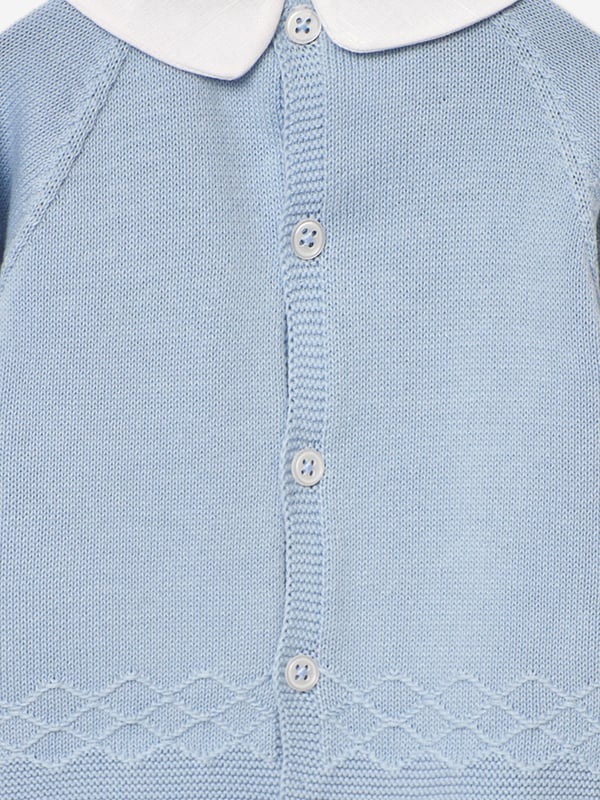 Paz Rodriguez depict high quality and fine detailing into their traditional aesthetics. This baby boys water green trouser set captures the label's sleek, innovative outlook. Engineered in refined knit. The sweater features a classic white collar with pearlescent shell buttons and white trims. The matching trousers come with an elasticated waistband. Made in Spain Two Piece Set 100 Cotton