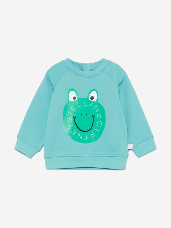 Stella McCartney portray a vibrant aesthetic via their cool and beautifully crafted designs. This baby boys aqua sweatshirt is woven from organic brushed cotton. It is embellished with frog print and a statement logo on the front for a cute and savvy designer style. There is a snap button fastening on the back to provide easy dressing. Long Sleeves Crew Neck Ribbed Cuffs and Hem 100 Organic Cotton