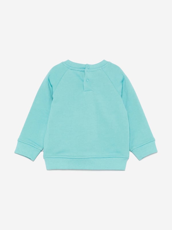 Stella McCartney portray a vibrant aesthetic via their cool and beautifully crafted designs. This baby boys aqua sweatshirt is woven from organic brushed cotton. It is embellished with frog print and a statement logo on the front for a cute and savvy designer style. There is a snap button fastening on the back to provide easy dressing. Long Sleeves Crew Neck Ribbed Cuffs and Hem 100 Organic Cotton
