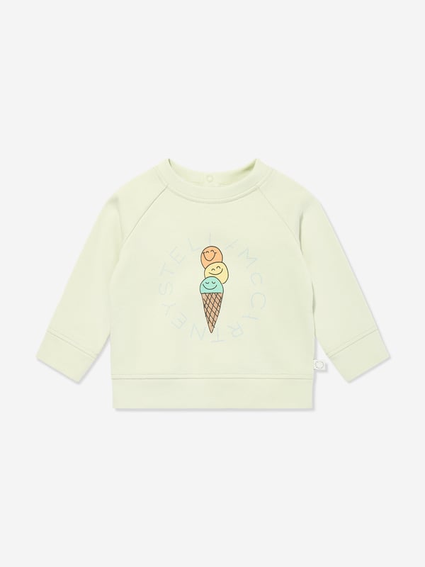 Stella McCartney portray a vibrant aesthetic via their cool and beautifully crafted designs. This baby unisex light mint green sweatshirt is woven with a colourful print of an ice cream cone showcasing smiley faces and a logo print in blue. Round Neckline Narrow Ribbed Edge Two Push Buttons Long Sleeves With Wide Ribbed Edges in the Sleeve and Waist Opening Main Material 100 Cotton Rib 98 Cotton 2 Elastane