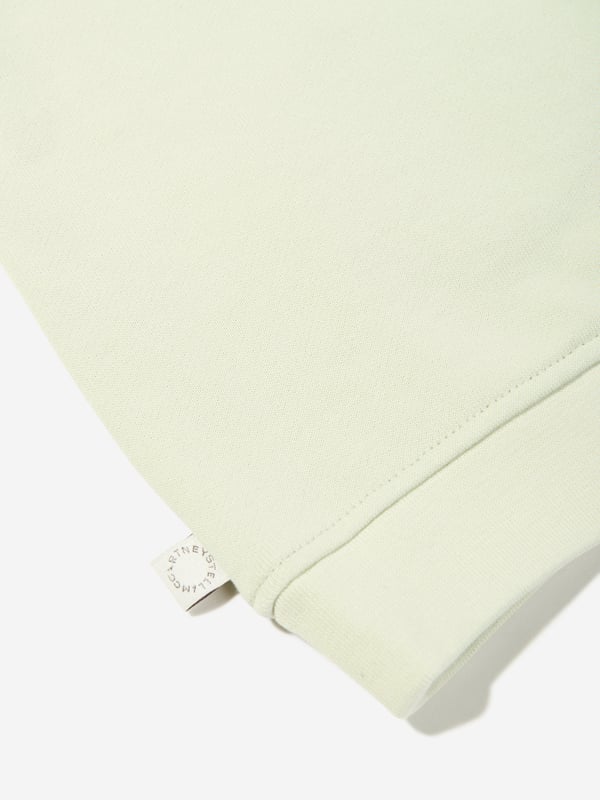 Stella McCartney portray a vibrant aesthetic via their cool and beautifully crafted designs. This baby unisex light mint green sweatshirt is woven with a colourful print of an ice cream cone showcasing smiley faces and a logo print in blue. Round Neckline Narrow Ribbed Edge Two Push Buttons Long Sleeves With Wide Ribbed Edges in the Sleeve and Waist Opening Main Material 100 Cotton Rib 98 Cotton 2 Elastane