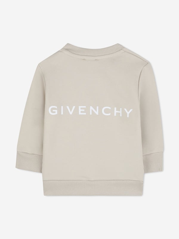 Givenchy incorporate sleek, enigmatic qualities into their lavish French abstracts. This baby boys cream sweatshirt is a Parisian staple piece to adore. Crafted from beautiful high quality cotton. It features a four '4G' print on the centre front via delicate ribbed trims. Round Neck Ribbed Trims Long Sleeves 85 Cotton, 15 Polyester