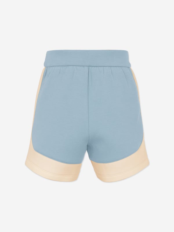 Baby Boys Colourblock Shorts in Blue Introducing the Emporio Armani Baby Boys Colourblock Shorts in Blue, a quintessential addition to your young chaps wardrobe for SS2025. Crafted with stylish comfort in mind, these shorts ensure your little one remains at the forefront of fashion. Key features include Distinctive Colourblock Design Striking blues merge for a fresh, eye-catching look. Premium Comfort Luxuriously soft fabrics ensure all-day ease for playful adventures. Iconic Branding Subtle Armani emblem adds a touch of elegance.Revitalise his summer attire with sophisticationperfect for sunny explorations!