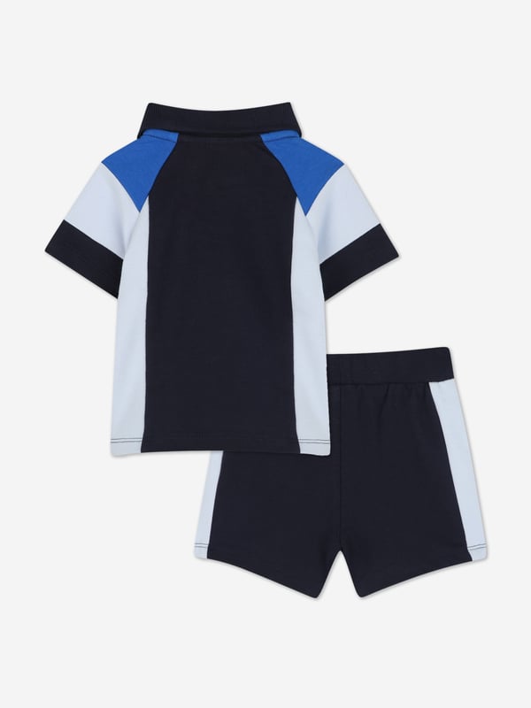 Introducing the exquisite BOSS Baby Boys Short Set in Navy, a quintessential addition to any young gentleman's wardrobe for SS2025. Crafted with precision by BOSS, this set is the epitome of both style and comfort. Key features include Elegant Navy Hue A classic and versatile colour perfect for any occasion. Superior Comfort Crafted from premium fabrics to ensure your little one enjoys supreme comfort. Designer Quality Impeccable BOSS craftsmanship guarantees a durable and stylish ensemble. Elevate your child's fashion ensemble with this luxurious set.