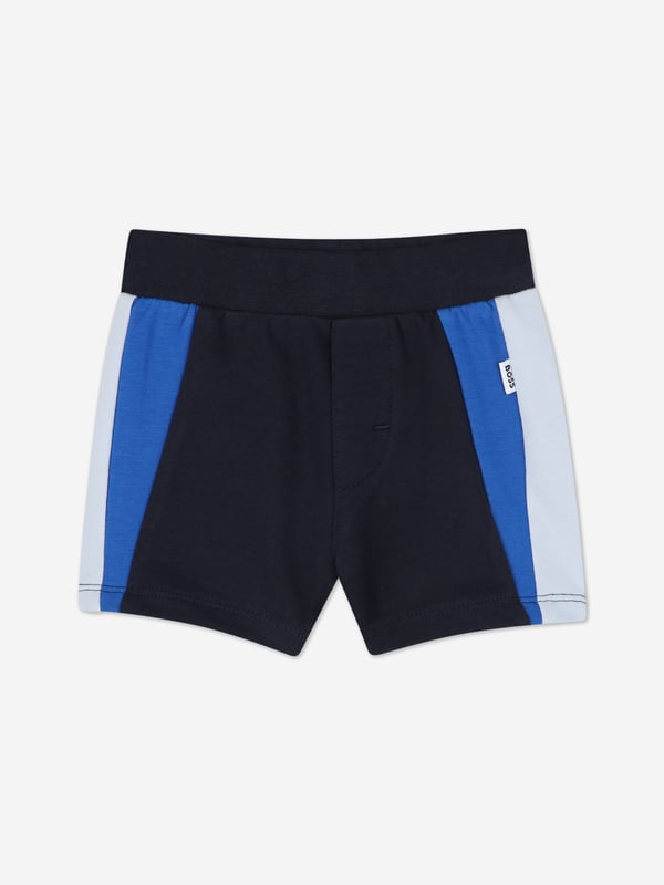 Introducing the exquisite BOSS Baby Boys Short Set in Navy, a quintessential addition to any young gentleman's wardrobe for SS2025. Crafted with precision by BOSS, this set is the epitome of both style and comfort. Key features include Elegant Navy Hue A classic and versatile colour perfect for any occasion. Superior Comfort Crafted from premium fabrics to ensure your little one enjoys supreme comfort. Designer Quality Impeccable BOSS craftsmanship guarantees a durable and stylish ensemble. Elevate your child's fashion ensemble with this luxurious set.