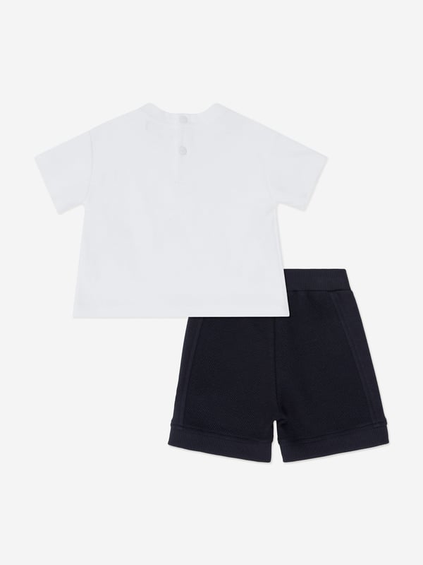 Presenting the exquisite Baby Boys Logo Short Set in Ivory by Emporio Armani a quintessential addition for your little gentlemans wardrobe for SS2025. Luxurious Craftsmanship Immaculately tailored with premium fabrics for unparalleled comfort. Signature Logo Detailing Features the iconic Emporio Armani logo, exuding a touch of class. Versatile Ivory Palette A soft, neutral colour perfect for any occasion, ensuring your boy stays in style. Breathable Fabric Ideal for keeping cool during warmer days, offering all-day comfort.Elevate your child's ensemble with this elegant short set from Emporio Armani. Shop now!