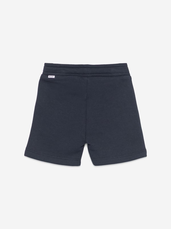 BOSS Baby Boys Logo Shorts in Navy Introduce the epitome of miniature chic with the BOSS Baby Boys Logo Shorts in Navy. Crafted with precision for SS2025, these shorts are the quintessence of style comfort for any young trendsetter. Here's why they're a must-have Elegant Navy Hue A classic, versatile colour that exudes sophistication. Iconic BOSS Branding Discreet yet distinctive logo detail for a touch of luxury. Premium Comfort Soft, breathable fabric ensures comfort all day long. Durable Design Made to withstand the adventures of playful toddlers.Refresh your little one's wardrobe with these stylish, high-quality shorts. Perfect for any occasion, they promise to keep him looking sharp feeling comfortable.