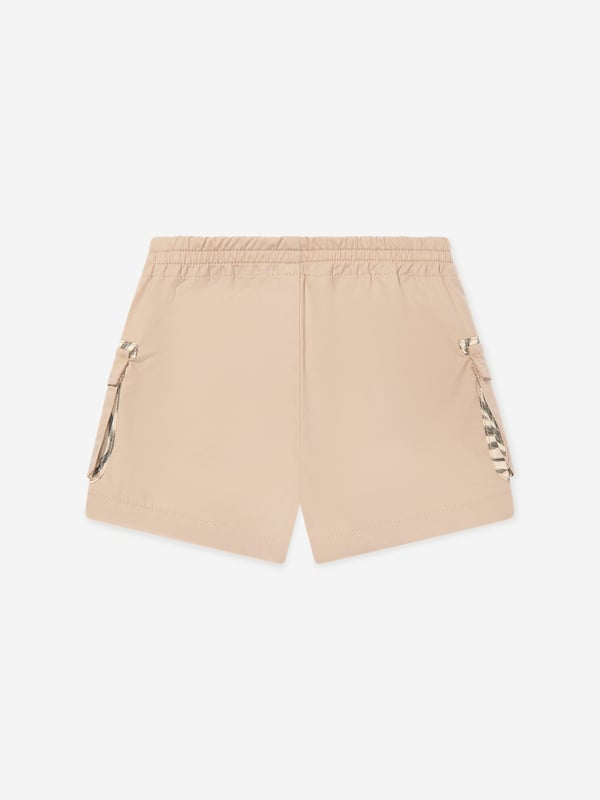 Introducing the exquisite Roberto Cavalli Baby Boys Cargo Shorts in Beige the pinnacle of luxury for your little gentleman's SS2025 wardrobe Italian Craftsmanship Expertly tailored in Italy, embodying unmatched quality and sophistication. Classic Hue Understated beige colour, ensuring versatility and timeless charm. Premium Fabric Constructed with the finest materials for unrivalled comfort and durability.Elevate your child's style with these impeccable Roberto Cavalli cargo shorts. Order now and embrace elegance!