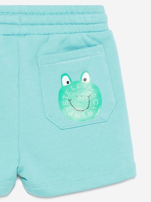 Introducing the Stella McCartney Baby Boys Jersey Shorts in Blue, an exquisite addition to any discerning little wardrobe for SS2025. Crafted with attention to detail, here are their standout features Luxurious Comfort Expertly made from soft, premium jersey, guaranteeing all-day ease. Classic Blue Hue A rich, vibrant blue that elevates everyday style. Versatile Appeal Perfect for playdates or park visits.Elevate your young one's collection with these charming shorts. Shop now for unmatched quality and sophistication!
