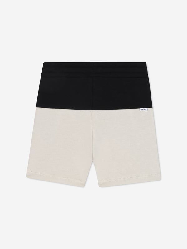Introducing the BOSS Baby Boys Colourblock Shorts in Black a sophisticated addition to any young gentleman's SS2025 wardrobe. Exquisitely crafted from premium materials, these shorts offer both flair and comfort. Notable features include Chic Colourblock Design Striking black hues paired with a clean, modern silhouette ensures your little one looks sharp. Supreme Comfort Soft, breathable fabric perfect for all-day play. Durable Fabrication Crafted to withstand the rigours of childhood. Elevate your child's style this season with BOSS.