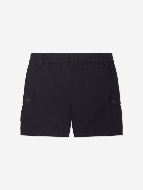Introducing the exquisite Baby Boys Cargo Shorts in Navy by Dolce Gabbana, a splendid addition to your little cherub's wardrobe for SS2025! Marvel in the Italian craftsmanship stylish flair of this piece Italian Elegance Meticulously tailored in Italy, these shorts promise unmatched quality sophisticated style. Classic Navy Hue The deep blue shade offers versatility and a touch of elegance to any outfit. Comfort Meets Style Designed with your child's comfort in mind, ensuring they look charming without compromising on ease.Perfect for any occasion, these cargo shorts will make your boy the epitome of youthful fashion! Order now to embrace timeless elegance.
