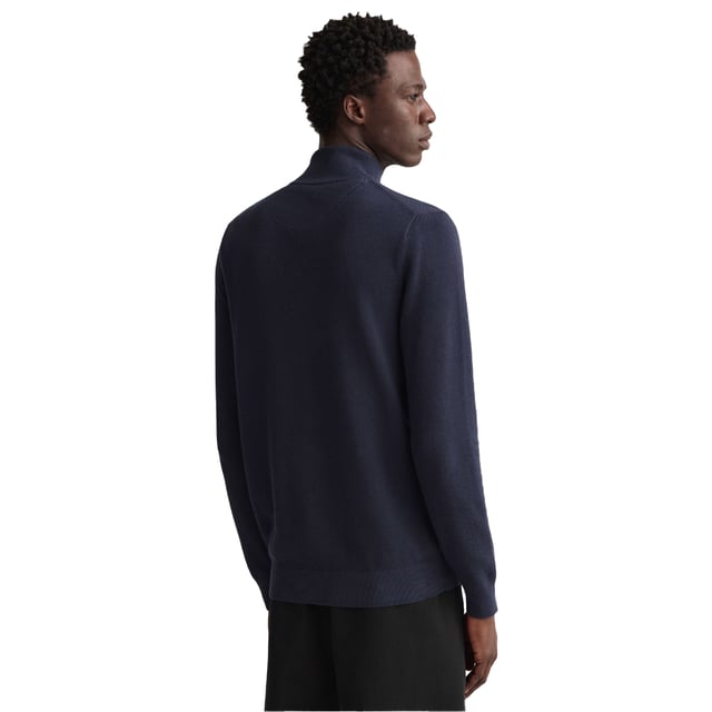 100% Baumwolle. Gewebe: Jerseyware, Piqué. Design: Gesticktes Logo, Unifarben. Saum: Anliegend, gerippt. Bündchen: Anliegend, gerippt. Hoch geschnitten. Langärmlig. Strukturiert. Passform: Regulär. Durchgehender Reißverschluss. S: 95,25 cm. M: 100 cm. L: 108 cm. XXL: 118,11 cm.